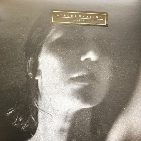 Album cover with a stylized portrait and 'Aldous Harding Party' text.