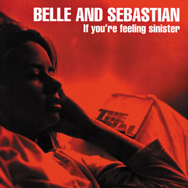 Album cover for 'If you're feeling sinister' by Belle and Sebastian with a person lying down and a book.