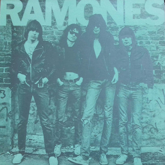 Album cover of Ramones with band members against a brick wall.